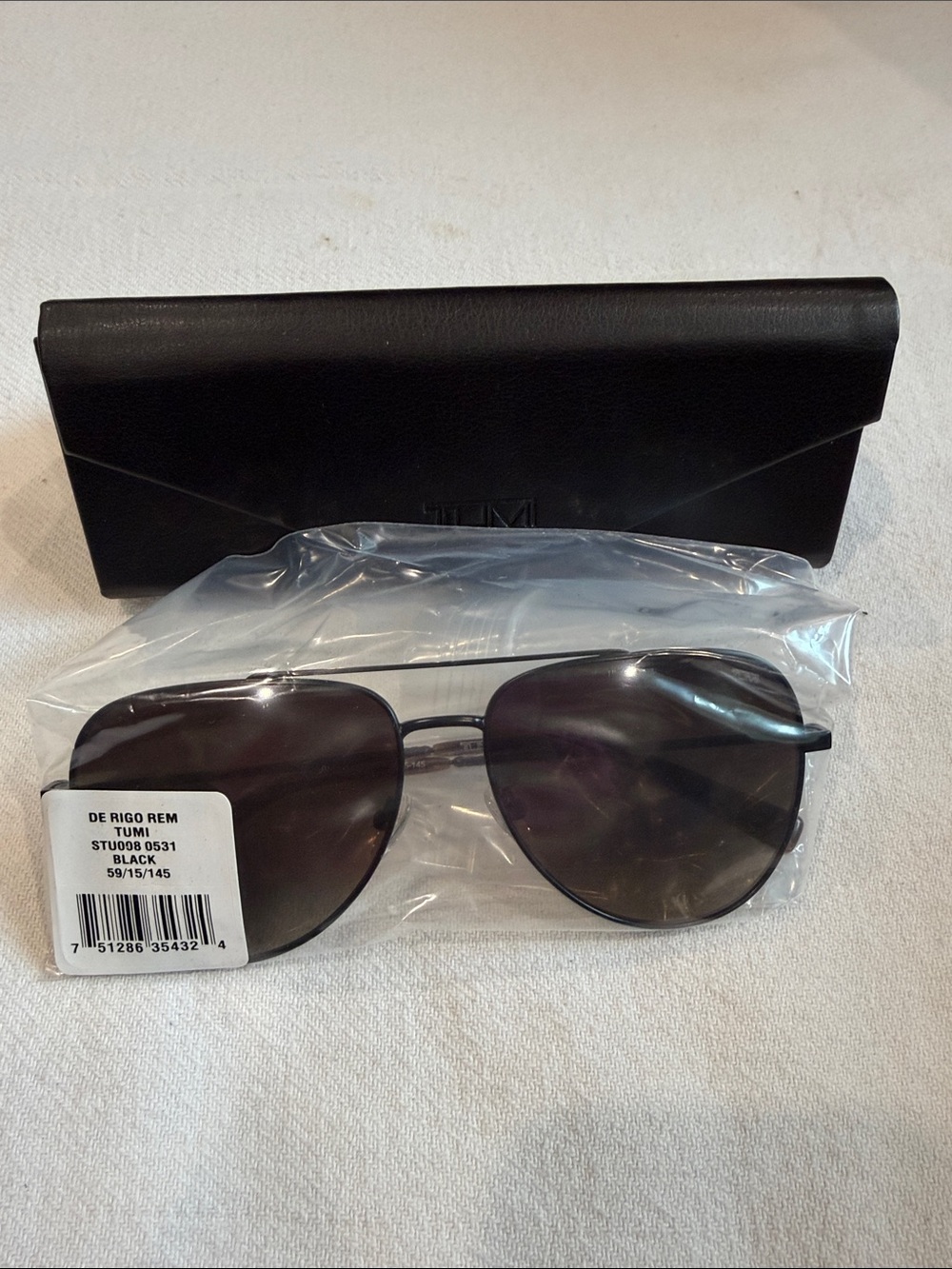 Tumi Black Aviator Sunglasses with Dark Lenses and Case